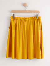 Kort gult viscose nederdel