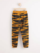 Sweatpants med sort og orange zebra mønster