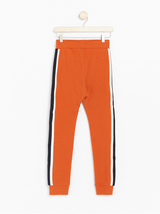 Orange sweatpants med sidestriber
