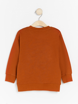 Oversize mørke orange sweater med terry dinosaur