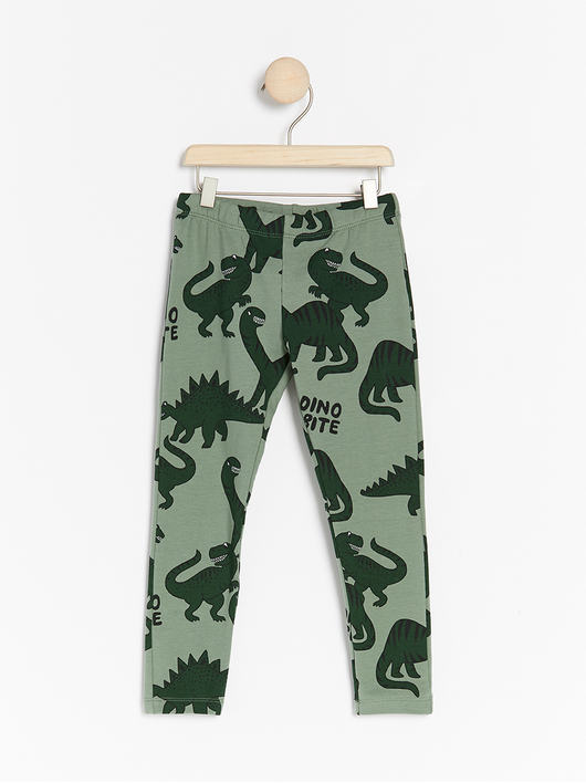 Grønne forede leggings med dinosaur print.