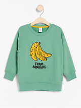 Oversize grøn trøje med banan print